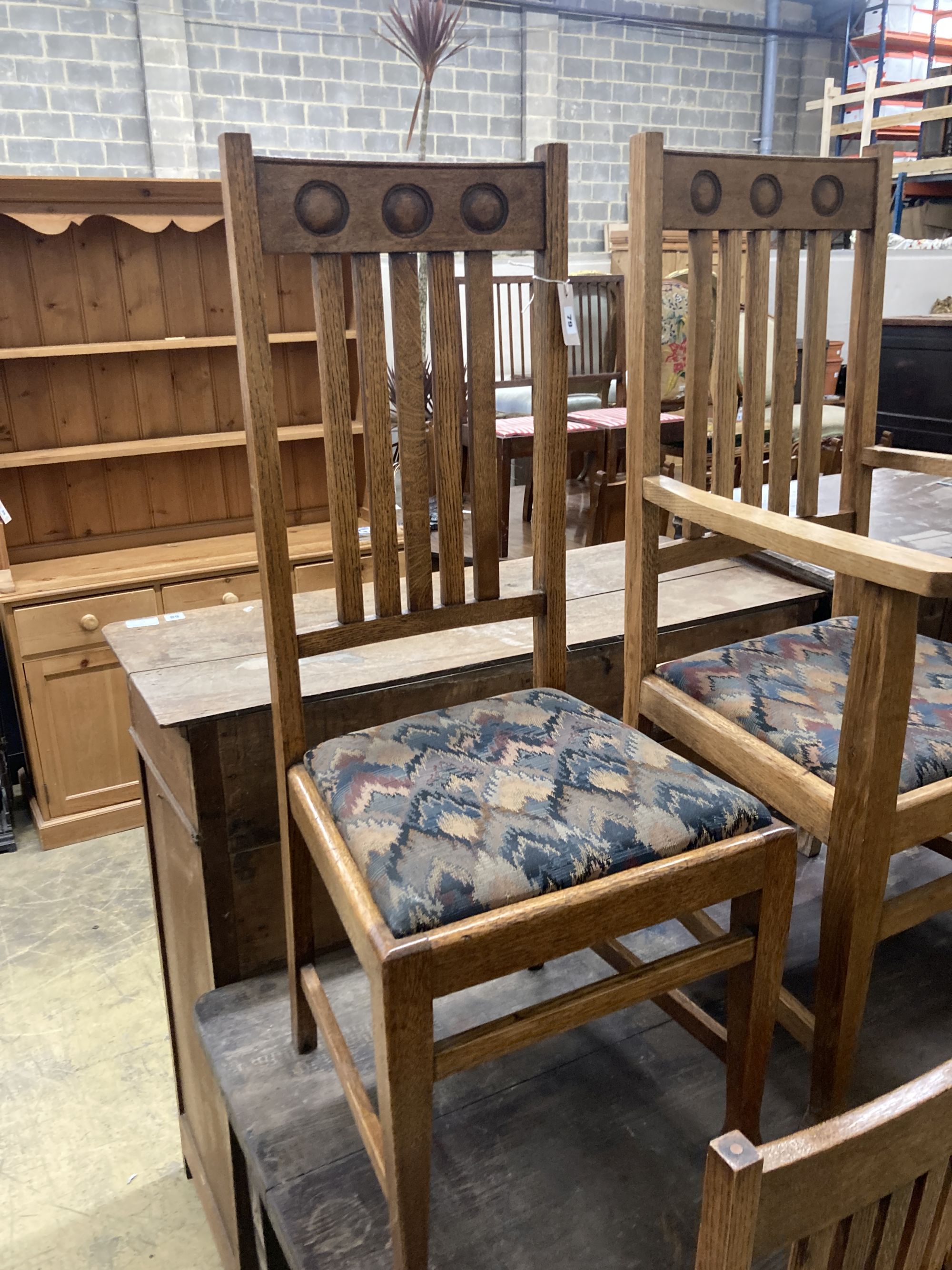 A set of six Arts & Crafts style oak dining chairs (two with arms)